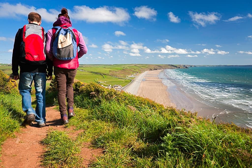 Couple walking on Coast Path